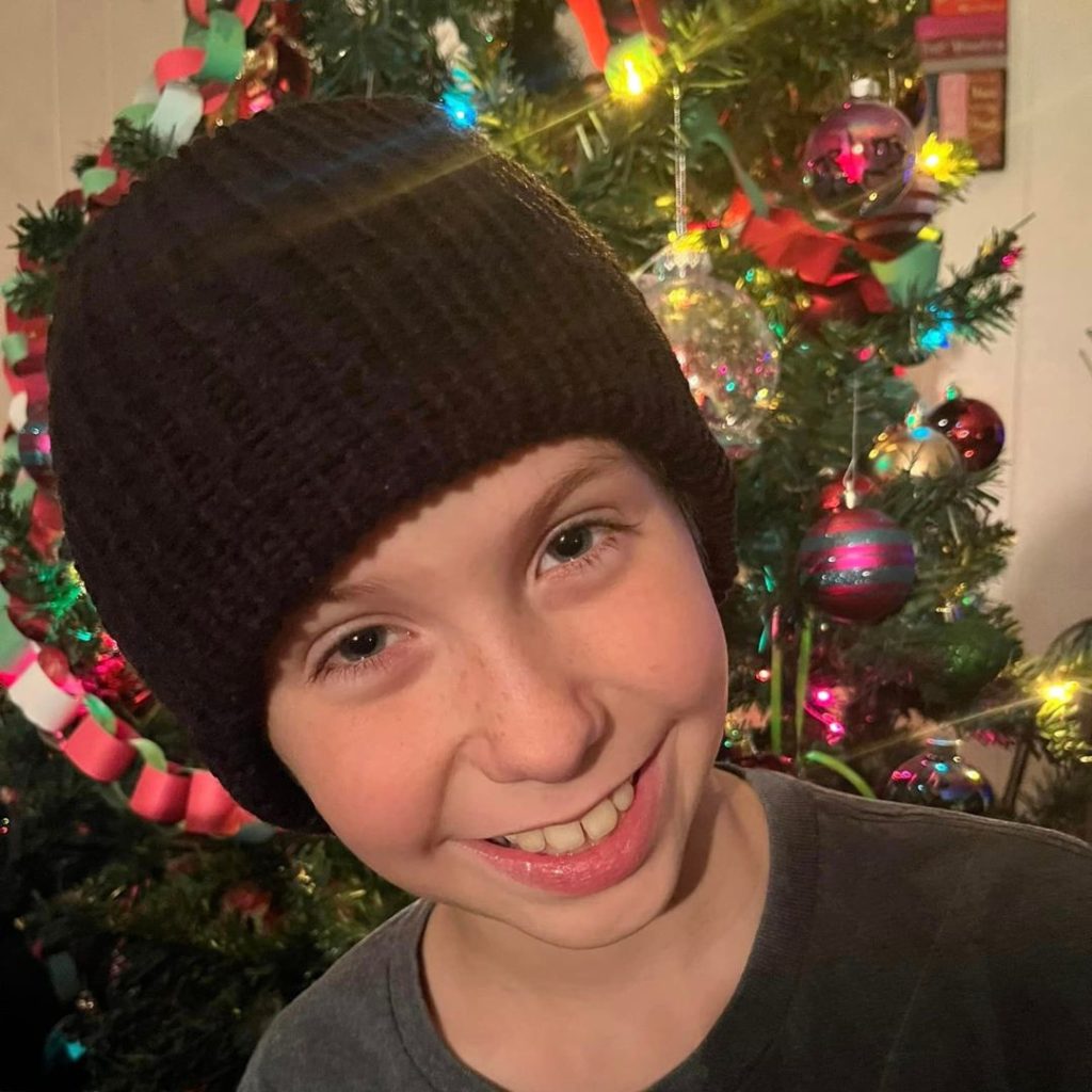Smiling child on Christmas Morning. Know them and buy/make gifts they'll love.