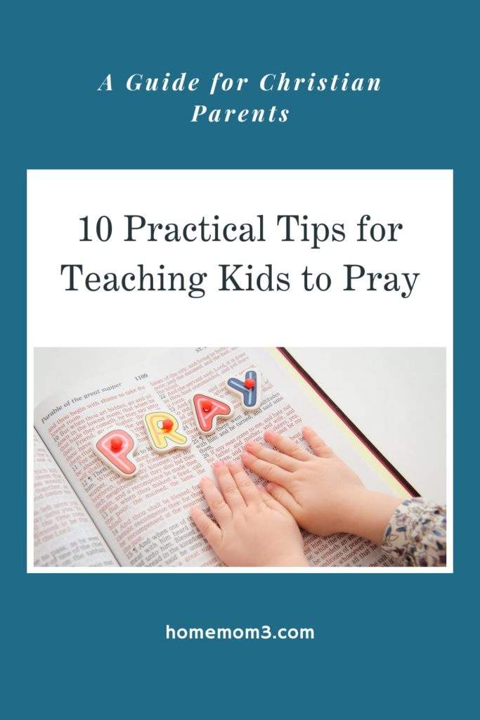 Little hands reading the bible with the words PRAY above the fingers. Teach kids to pray.